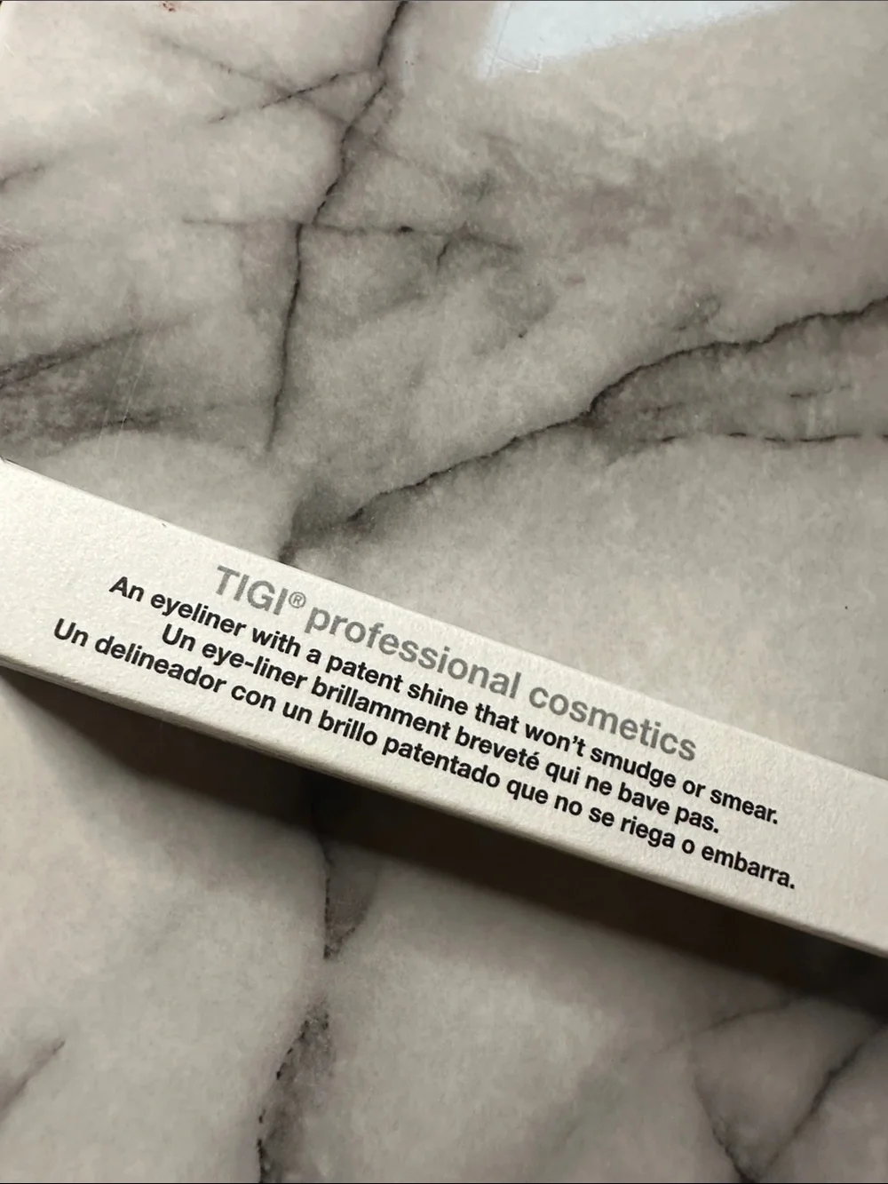 TIGI Compact Pressed Setting Powder color- Entice, black liquid eyeliner